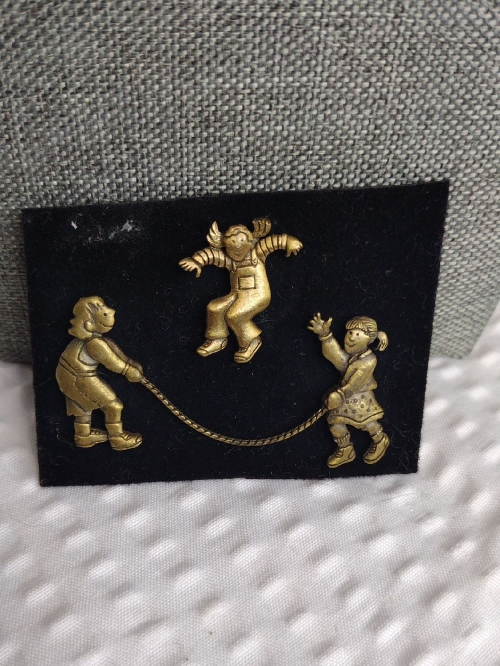 JJ Jonette pin featuring two separate pins that form a jumping rope design. VTG
